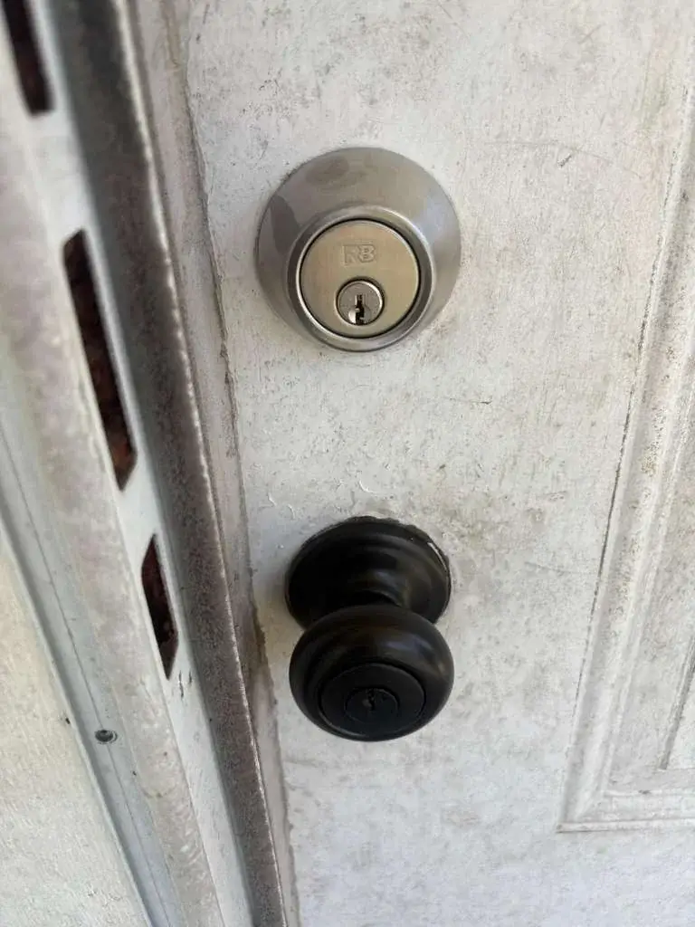 Deadbolt and doorknob alignment on an open residential door