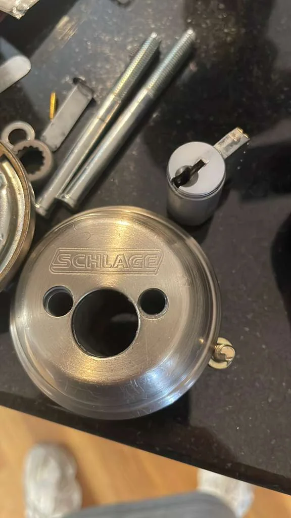 Residential lock cylinder removed for inspection and repair